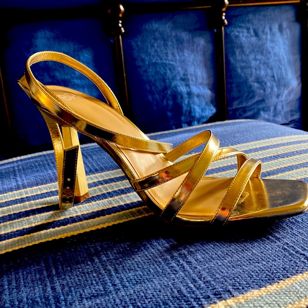 Very gently used gold strap heals. Worn one time! About three-four inch heel.